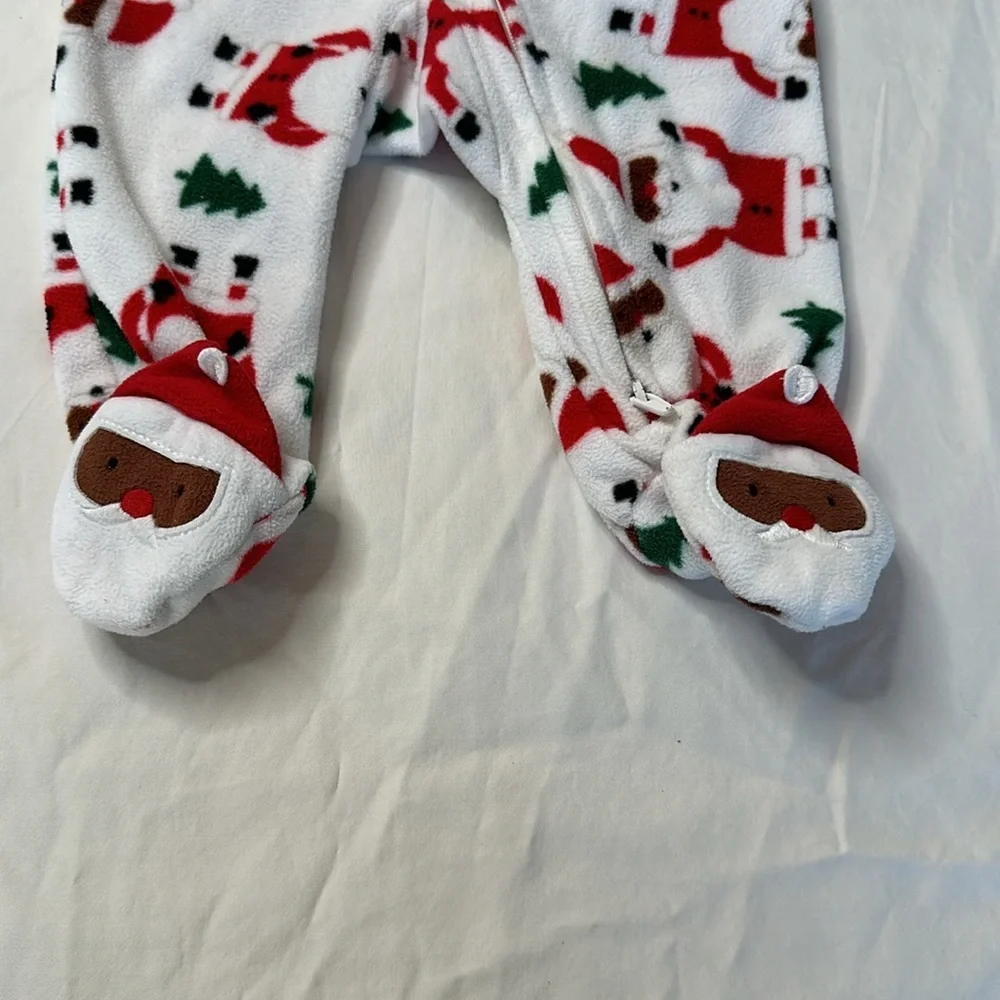 Carter’s baby girl Christmas bundle. One pair of fleece footed pajamas, one tutu